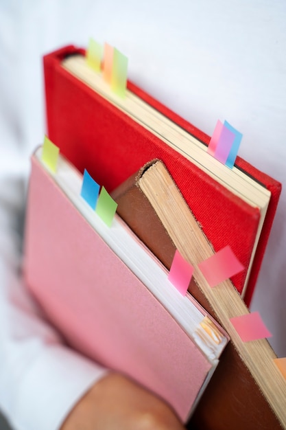 Free photo high angle model holding books