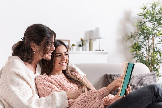 High angle mom and girl reading