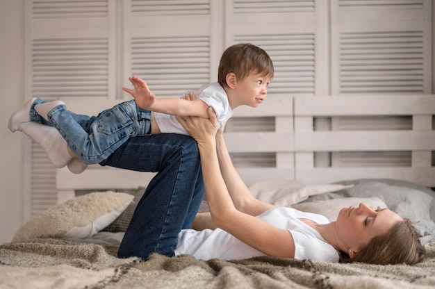 Free photo high angle mom and son at home