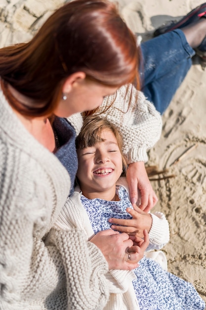 High angle mother holding little girl