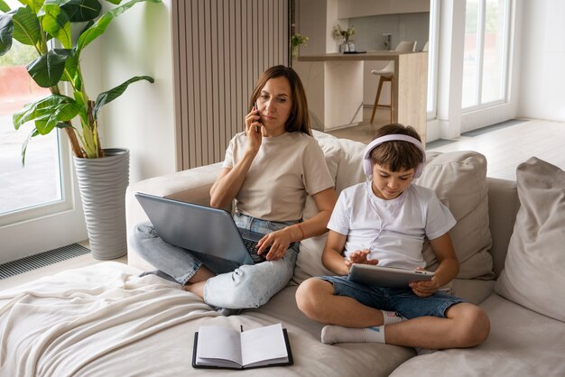 High angle mother teleworking from home