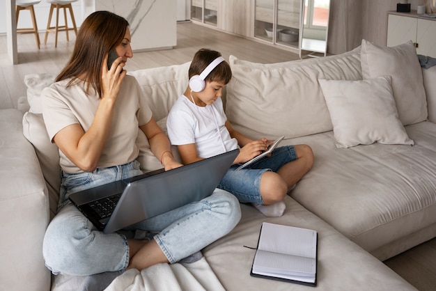 High angle mother teleworking from home