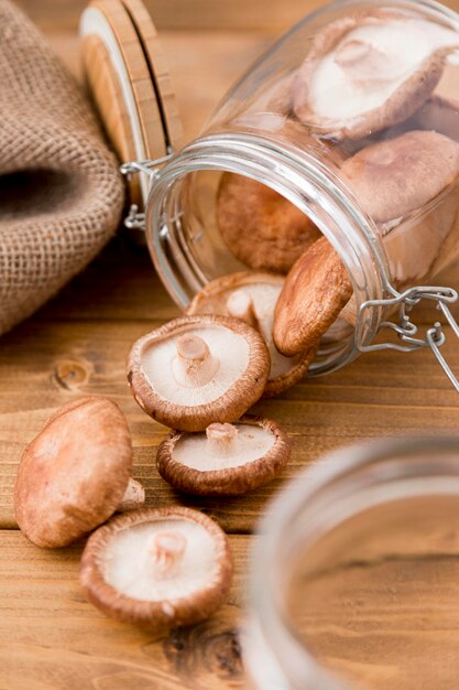 High angle of mushrooms in glass jar