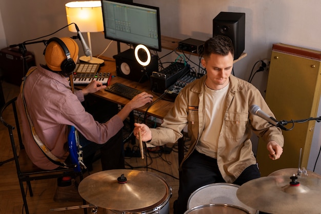 High angle musicians working in studio