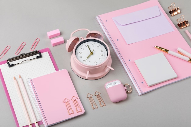 High angle notebook and clock assortment