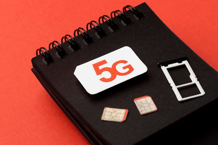 Free Photo high angle of notebook with sim card