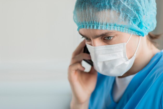 High angle nurse talking over phone