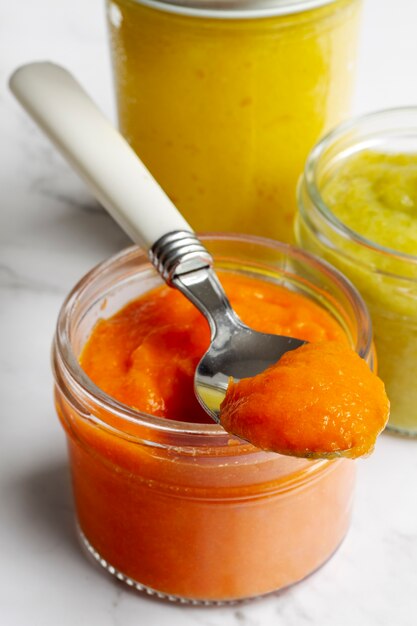 High angle nutritious baby food in jars