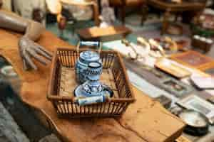 Free photo high angle old vessels at second hand market