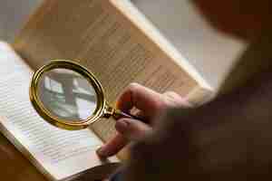 Free photo high angle old woman reading at home