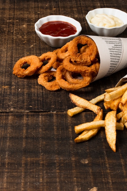 High angle of onion rings and fries