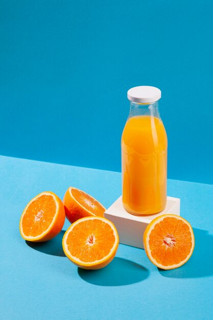 Free photo high angle orange juice bottle