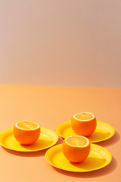 Free photo high angle oranges on plates