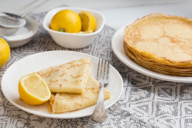 High angle pancakes with lemons