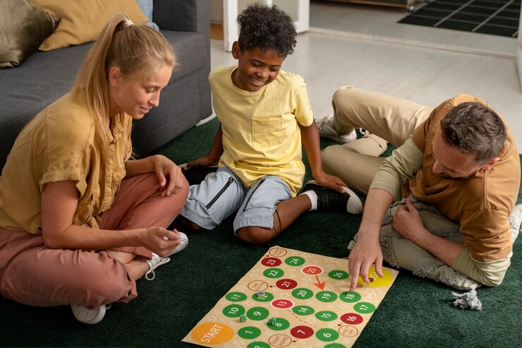 Free Photo high angle parents and kid playing game
