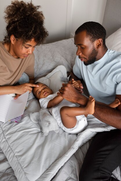 High angle parents taking care of baby