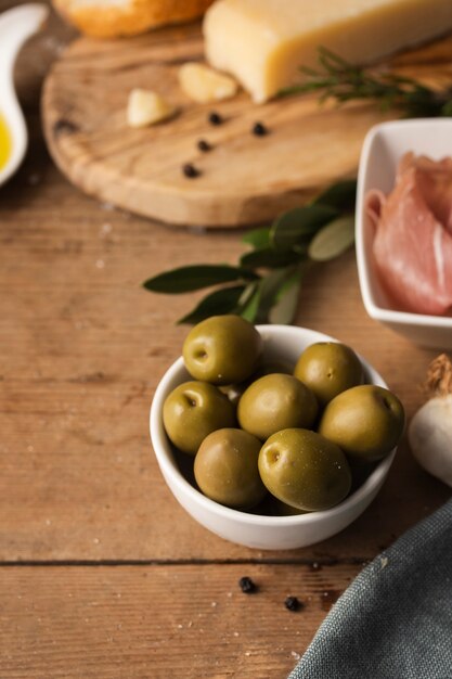High angle parmesan prosciutto and olives
