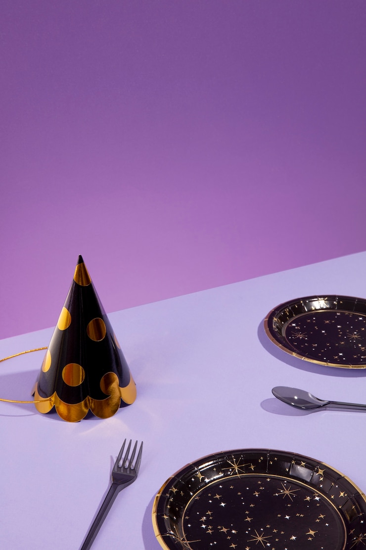 Free Photo high angle party hat and plates arrangement