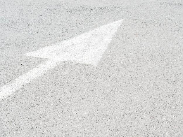 High angle of path arrow on asphalt