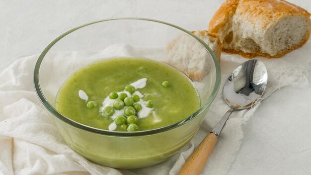 High angle pea soup with bread