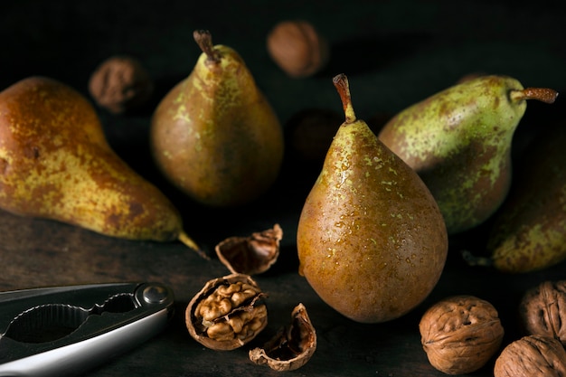 Free photo high angle of pears with walnuts