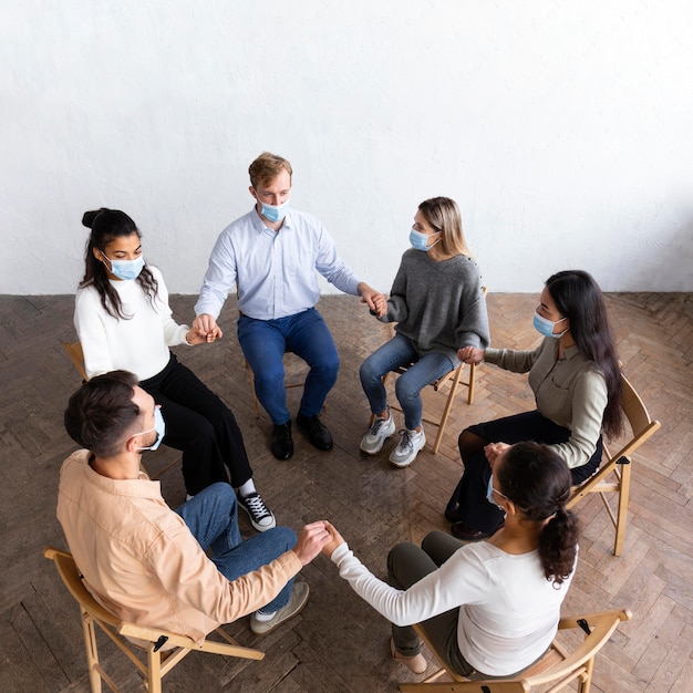 High angle of people in group therapy session