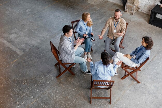 High angle people at group therapy