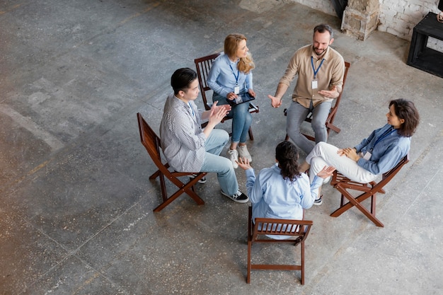 High angle people at group therapy