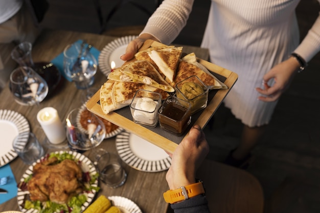 Free photo high angle people holding plate