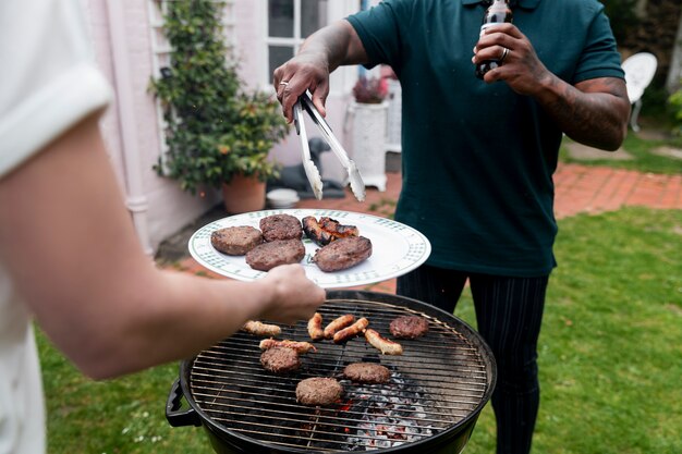 High angle people making barbecue