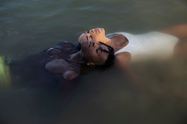 Free photo high angle people swimming together