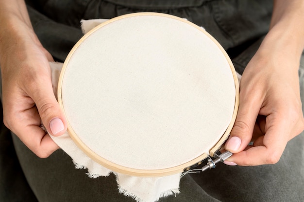 High angle of person preparing textile for sewing