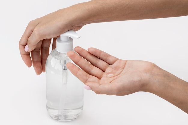 High angle person using liquid soap