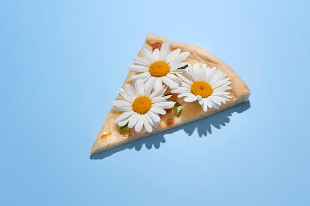 High angle pizza slice with flowers