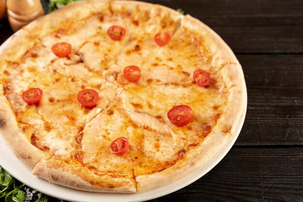 High angle of pizza on wooden table