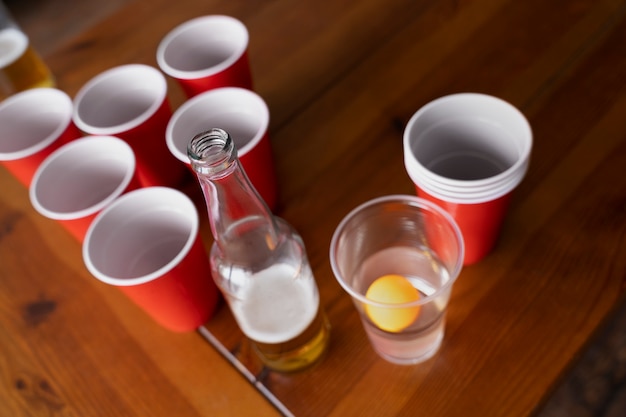 High angle of plastic cups used for beer pong at a party