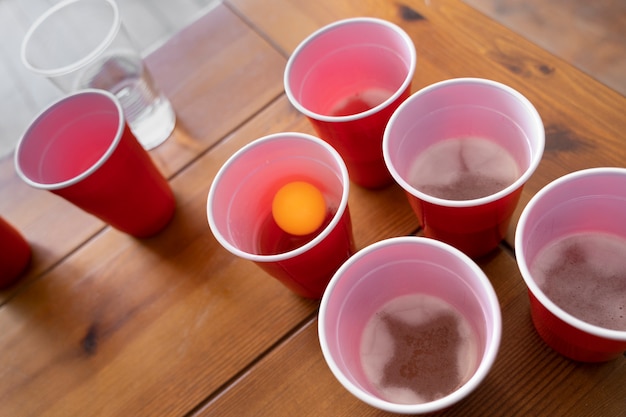 High angle of plastic cups used for beer pong at a party