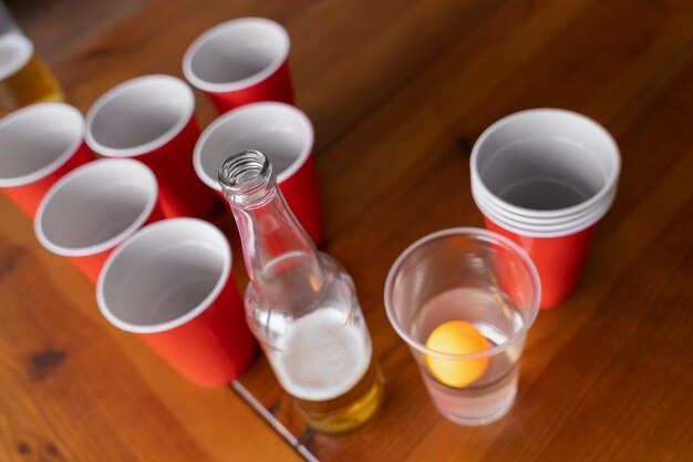 High angle of plastic cups used for beer pong at a party