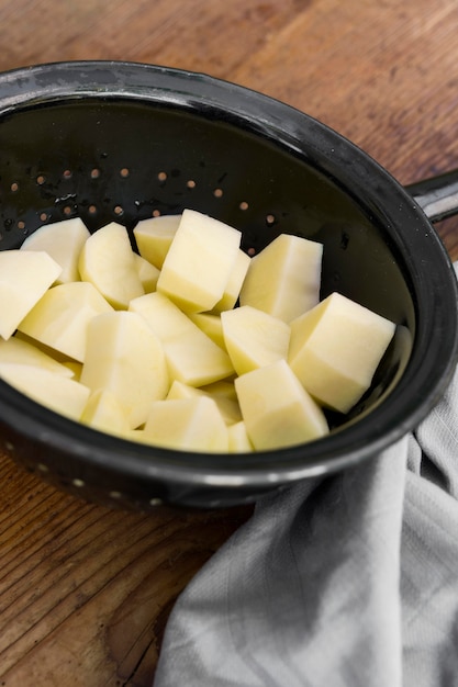 Free photo high angle potatoes in colander