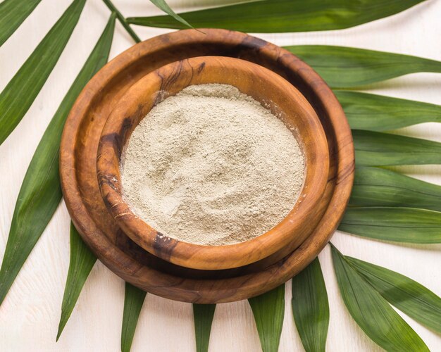 High angle of powder in bowl with leaves