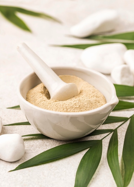 High angle of powder in bowl with pestle