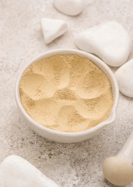 High angle of powder in bowl with stones