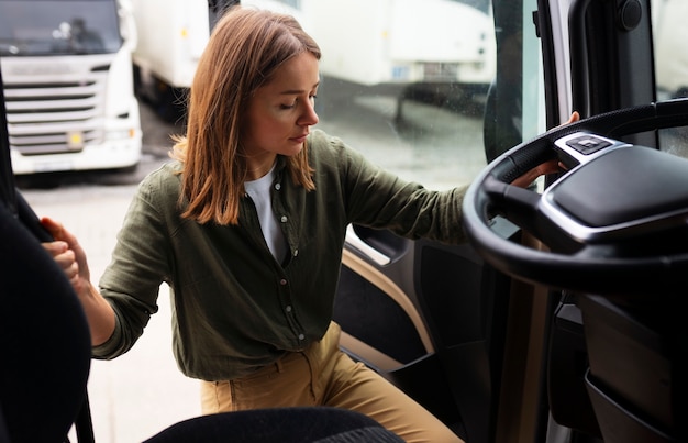 Free photo high angle professional female driver in truck