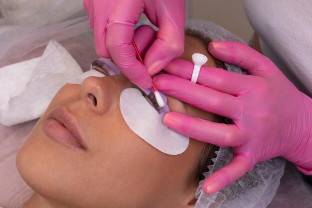 high angle professional using cotton swab