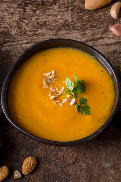 High angle pumpkin cream soup in bowl