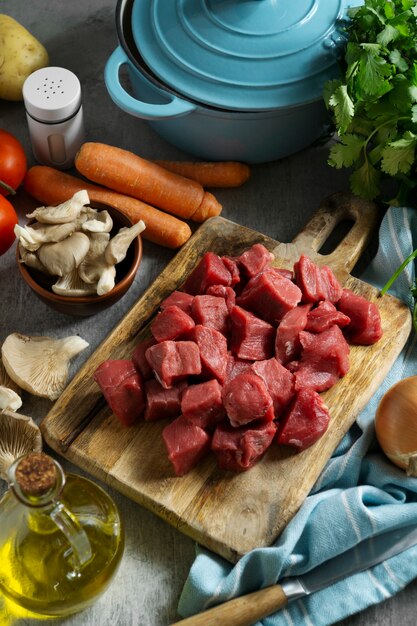 High angle raw beef and vegetables arrangement