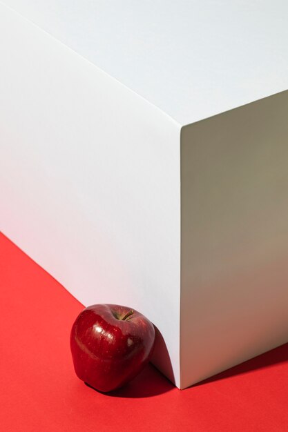 High angle of red apple next to podium