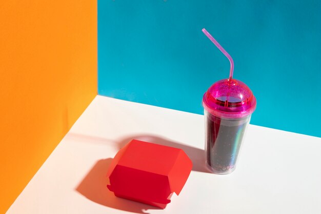 High angle red box and juice cup