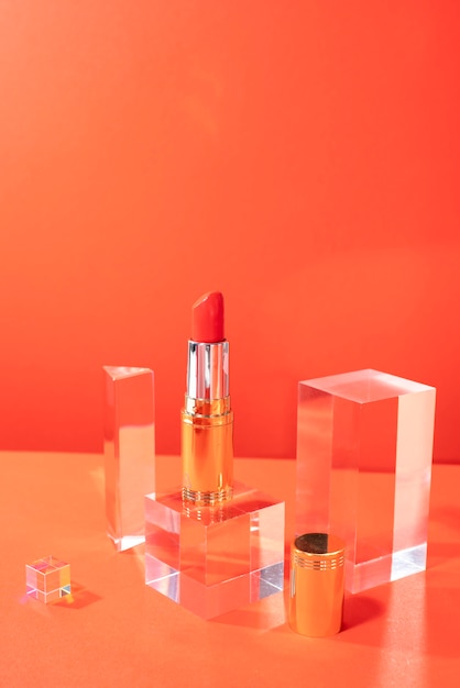 Free photo high angle red lipstick still life