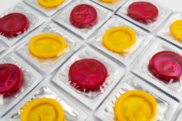 Free photo high angle red and yellow condoms